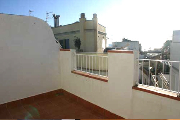 Sunny roof terrace with view over Sitges
